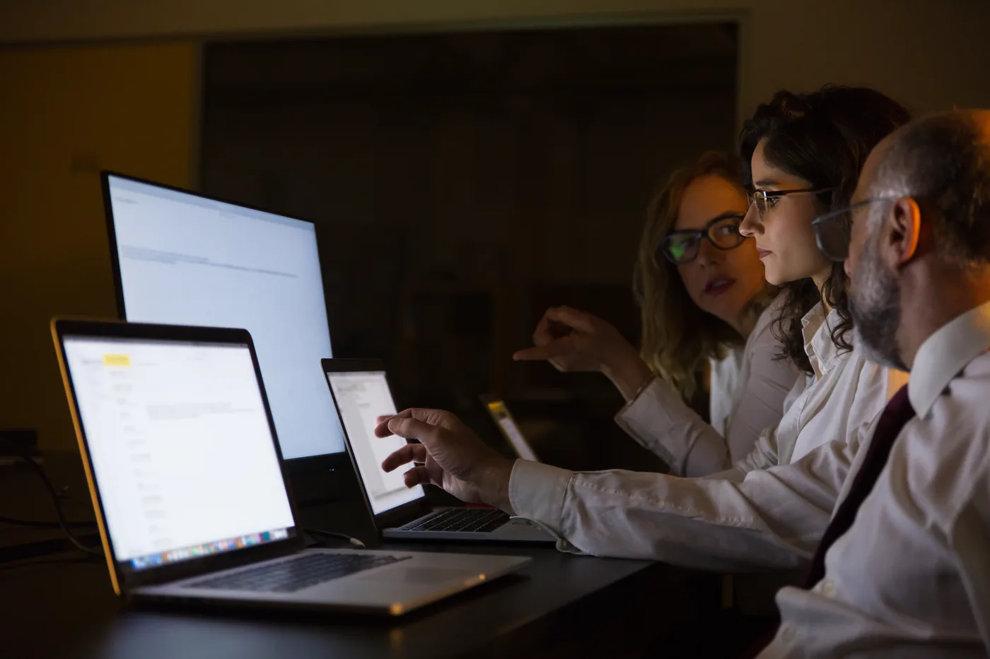Healthcare team reviewing website copy on laptops